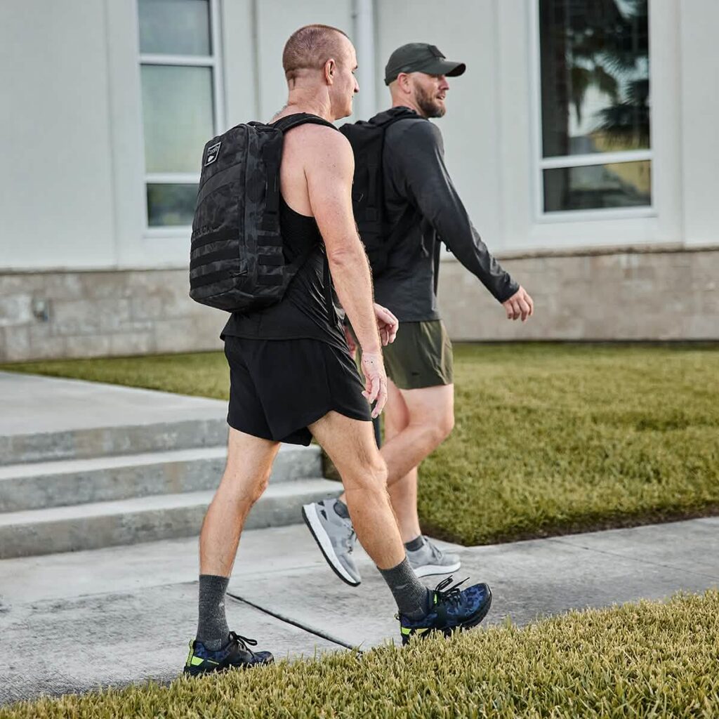 The image showcases Rough Runners rucking shoes.